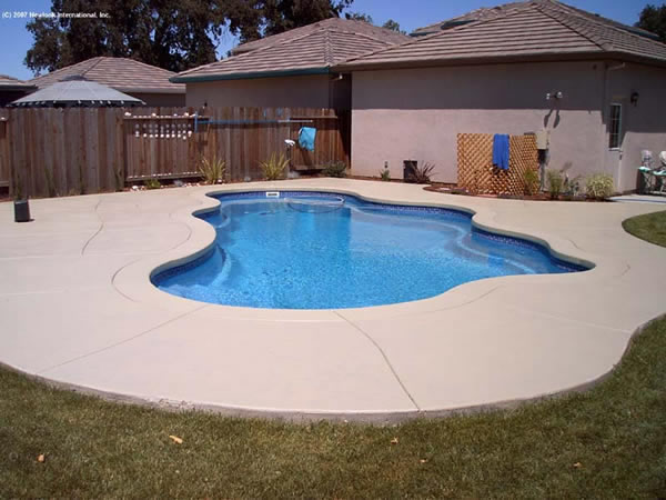 Pool photo with colour stained concrete surround